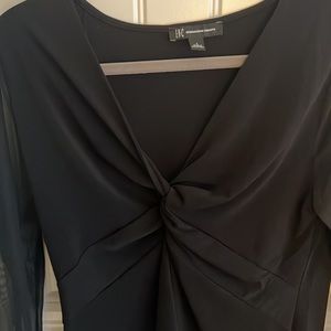 Smoke free home. New. Never warn. Beautiful INC black top. Arms are shear.